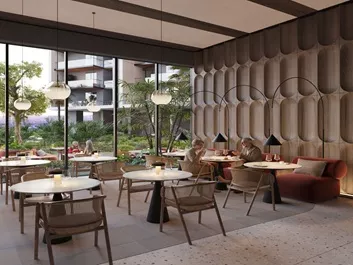 Elegant residents' lounge and cafe-style seating area with modern interior design