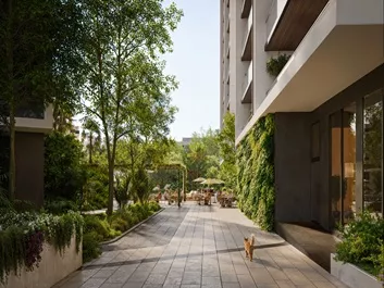 Aura Aerth Landscaped residential walkway with lush greenery